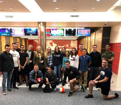 Cadets pose for a picture at a Sacred Heart bowling event