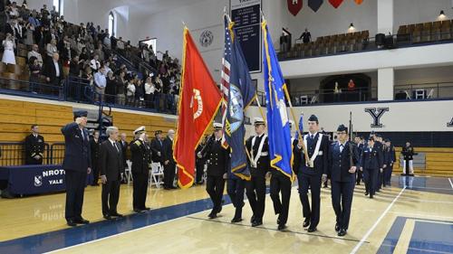 ROTC members holding flags during ceremony